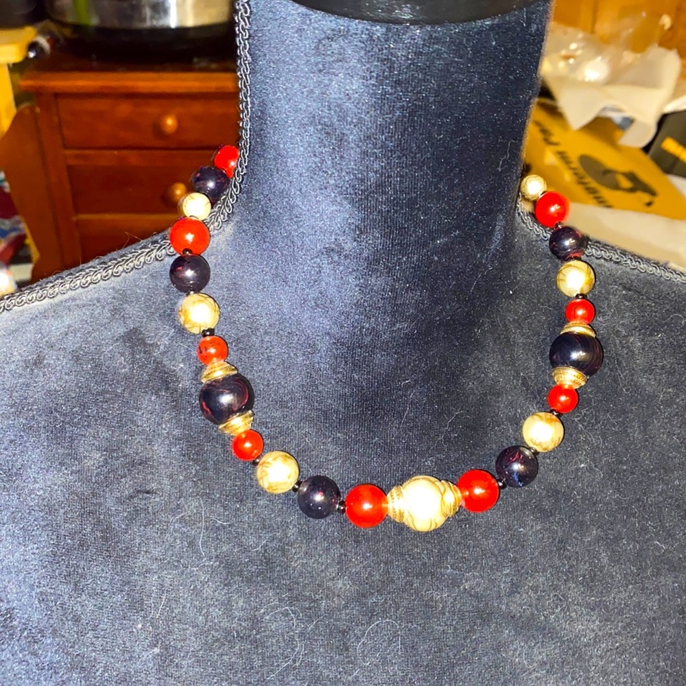 Vintage Avon necklace red, black, and white. Different size beads.